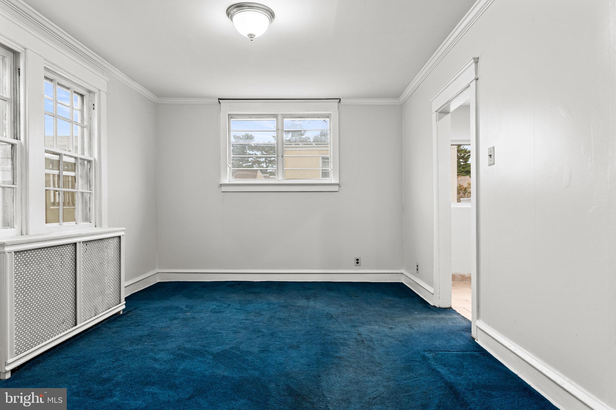 221 Barrington Road Upper Darby, PA 19082 - Photo 8 of 29 an empty room with wooden floor and windows