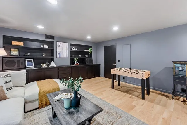 a living room with furniture and a table