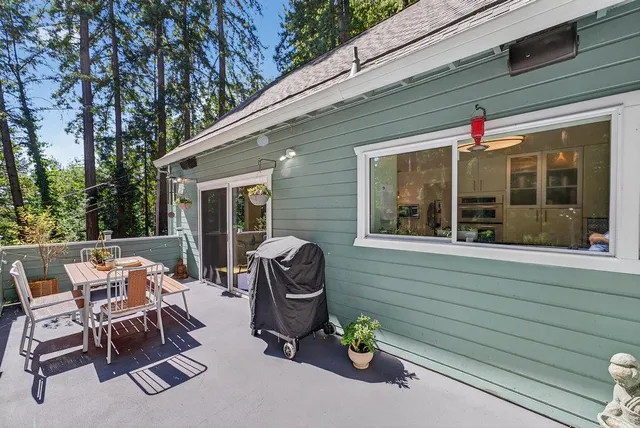 a view of a two chairs in the balcony