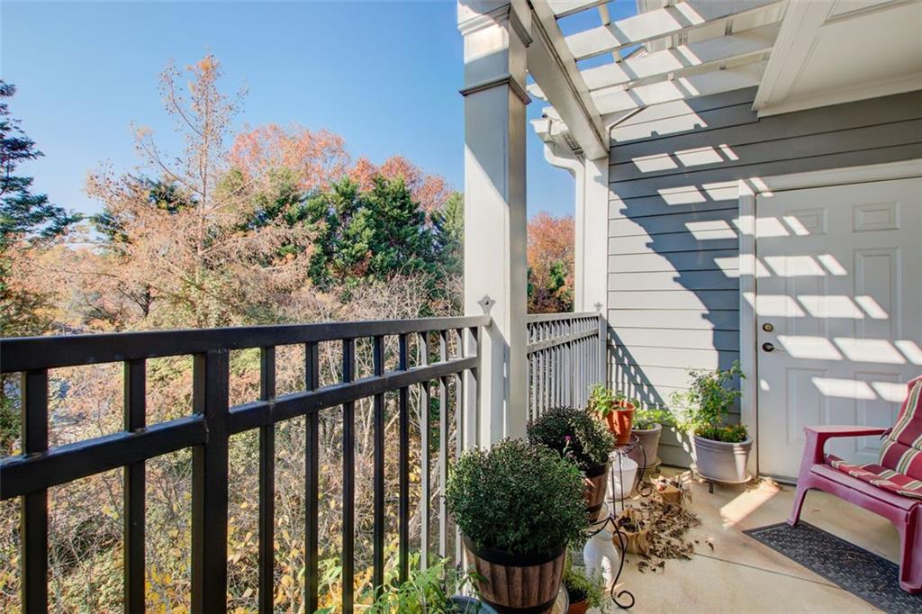 4100 Paces Walk Southeast, Unit 1306 Atlanta, GA 30339 - Photo 13 of 32 a view of a chairs on the roof deck