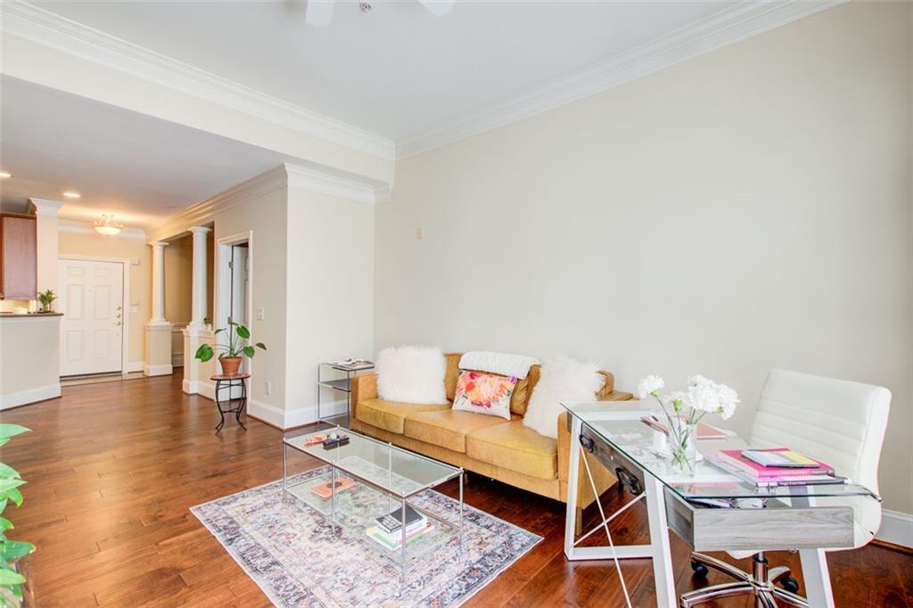 4100 Paces Walk Southeast, Unit 1306 Atlanta, GA 30339 - Photo 22 of 32 a living room with furniture and a wooden floor