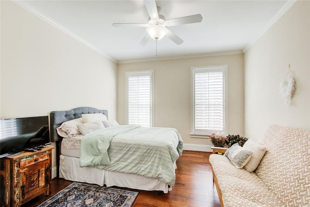4100 Paces Walk Southeast, Unit 1306 Atlanta, GA 30339 - Photo 25 of 32 a bedroom with a bed and a couch