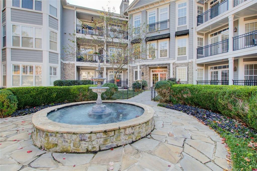 4100 Paces Walk Southeast, Unit 1306 Atlanta, GA 30339 - Photo 28 of 32 a view of outdoor space swimming pool and outdoor seating