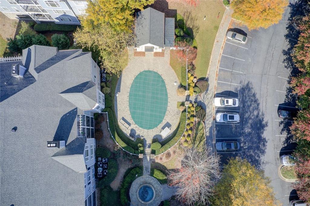 4100 Paces Walk Southeast, Unit 1306 Atlanta, GA 30339 - Photo 29 of 32 an aerial view of a house with a swimming pool