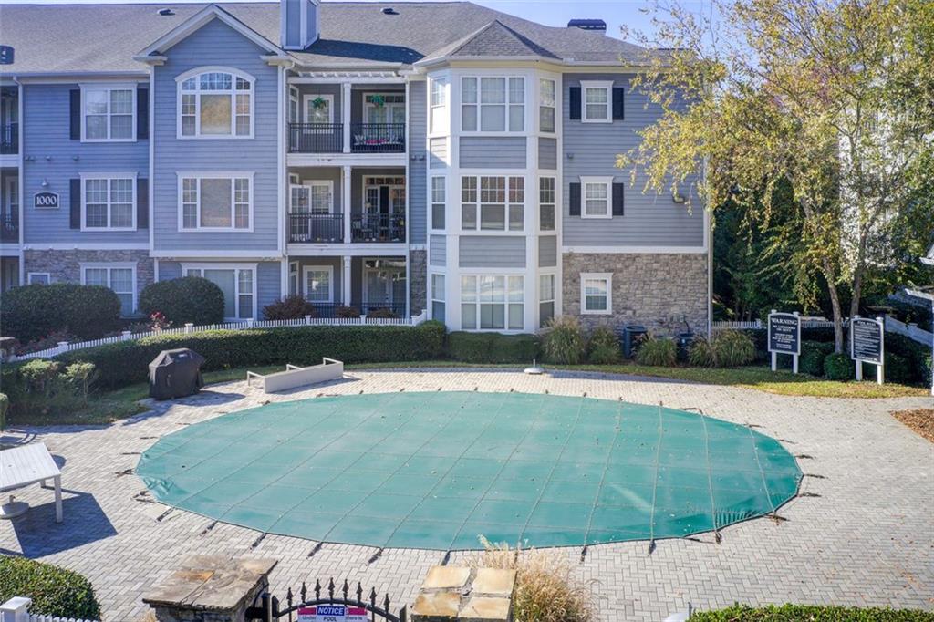 4100 Paces Walk Southeast, Unit 1306 Atlanta, GA 30339 - Photo 30 of 32 a front view of a house with a yard