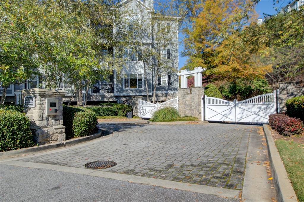 4100 Paces Walk Southeast, Unit 1306 Atlanta, GA 30339 - Photo 3 of 32 front view of a house with a yard