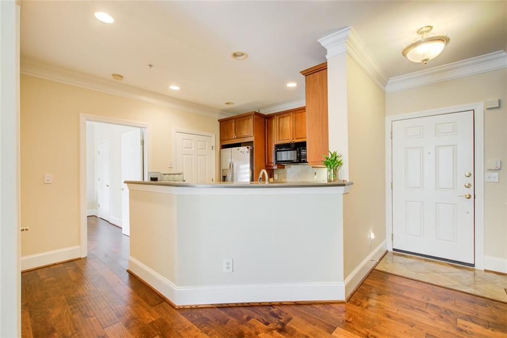 4100 Paces Walk Southeast, Unit 1306 Atlanta, GA 30339 - Photo 9 of 32 a view of kitchen with furniture and wooden floor