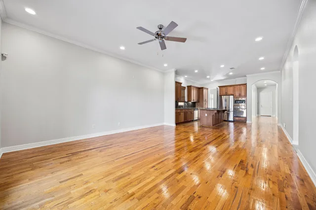 a view of a living room and a kitchen with a sink
