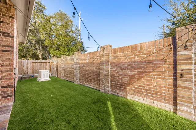 a view of an apartment with a fence