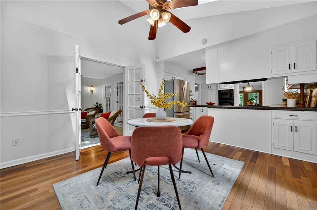 7565 Ball Mill Road Northeast Atlanta, GA 30350 - Photo 12 of 61 a dining room with furniture and wooden floor