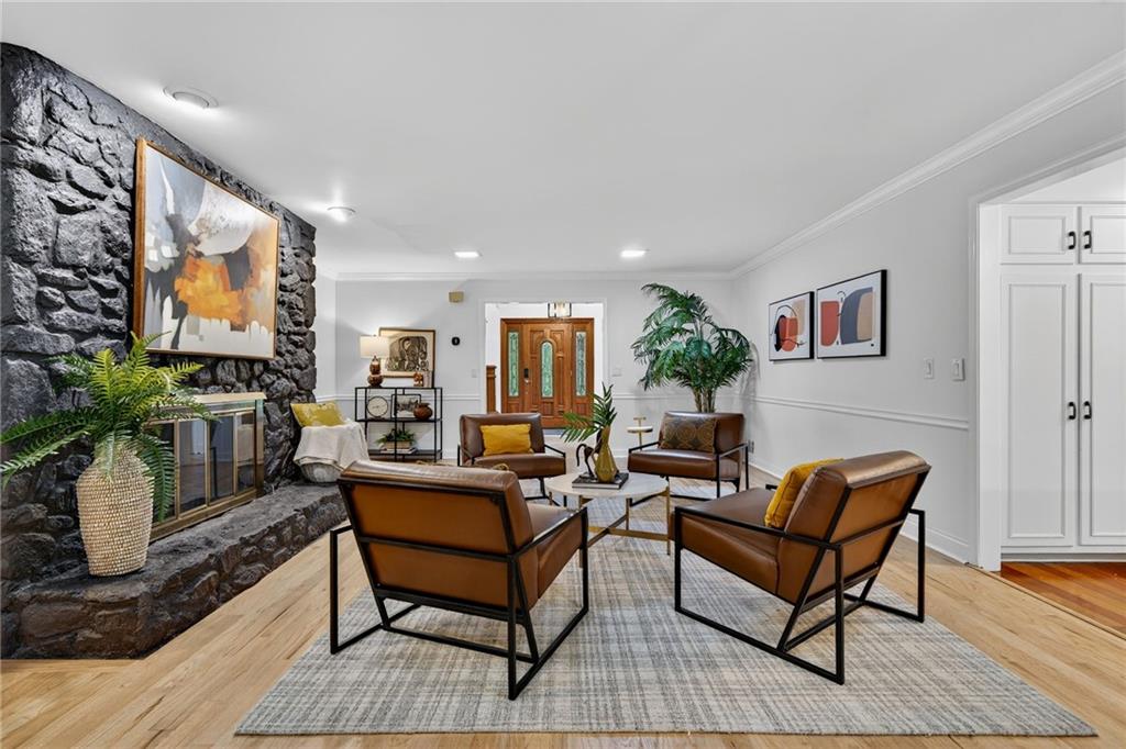 7565 Ball Mill Road Northeast Atlanta, GA 30350 - Photo 14 of 61 a living room with furniture and a flat screen tv