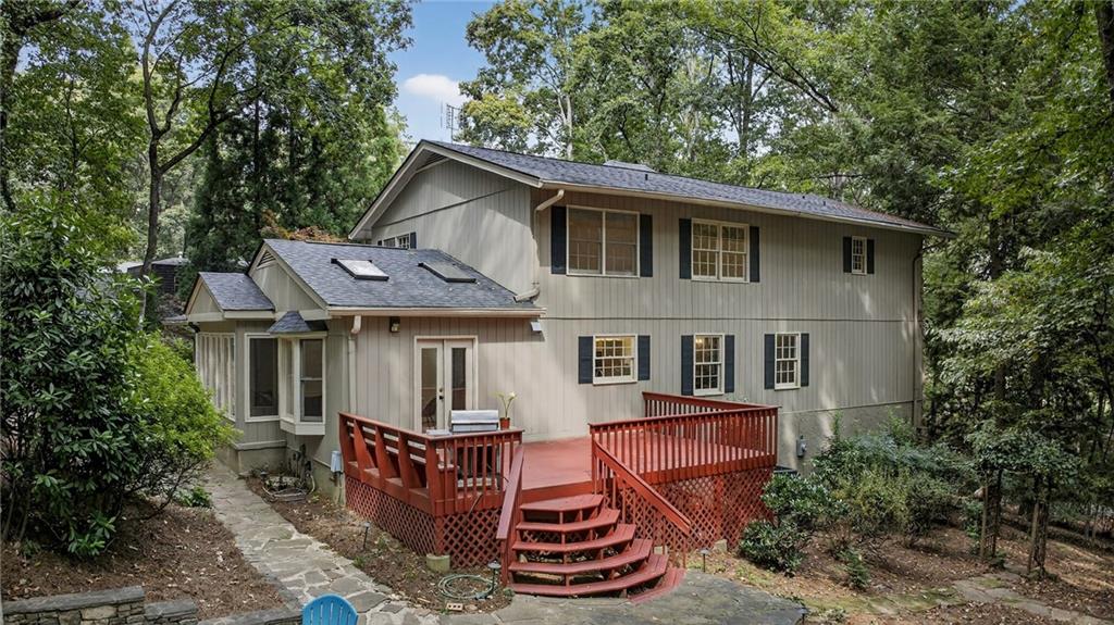 7565 Ball Mill Road Northeast Atlanta, GA 30350 - Photo 15 of 61 a front view of a house with a yard