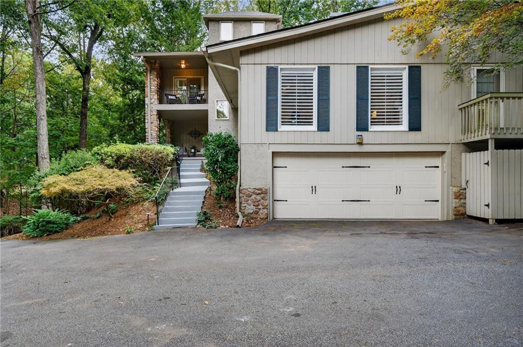7565 Ball Mill Road Northeast Atlanta, GA 30350 - Photo 16 of 61 front view of a house with a small yard