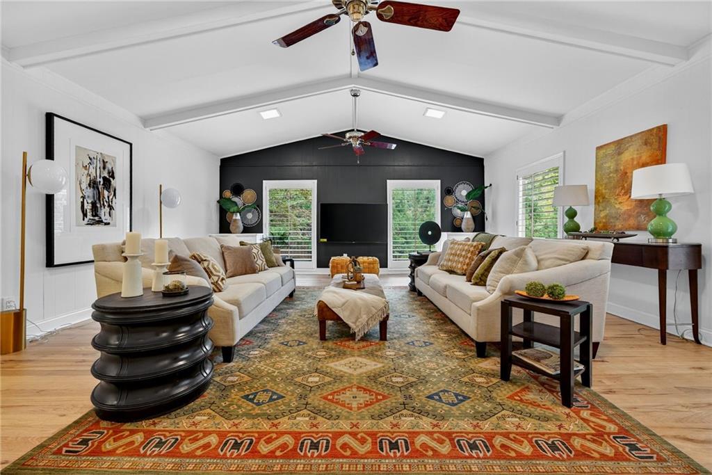 7565 Ball Mill Road Northeast Atlanta, GA 30350 - Photo 2 of 61 a living room with furniture and a chandelier