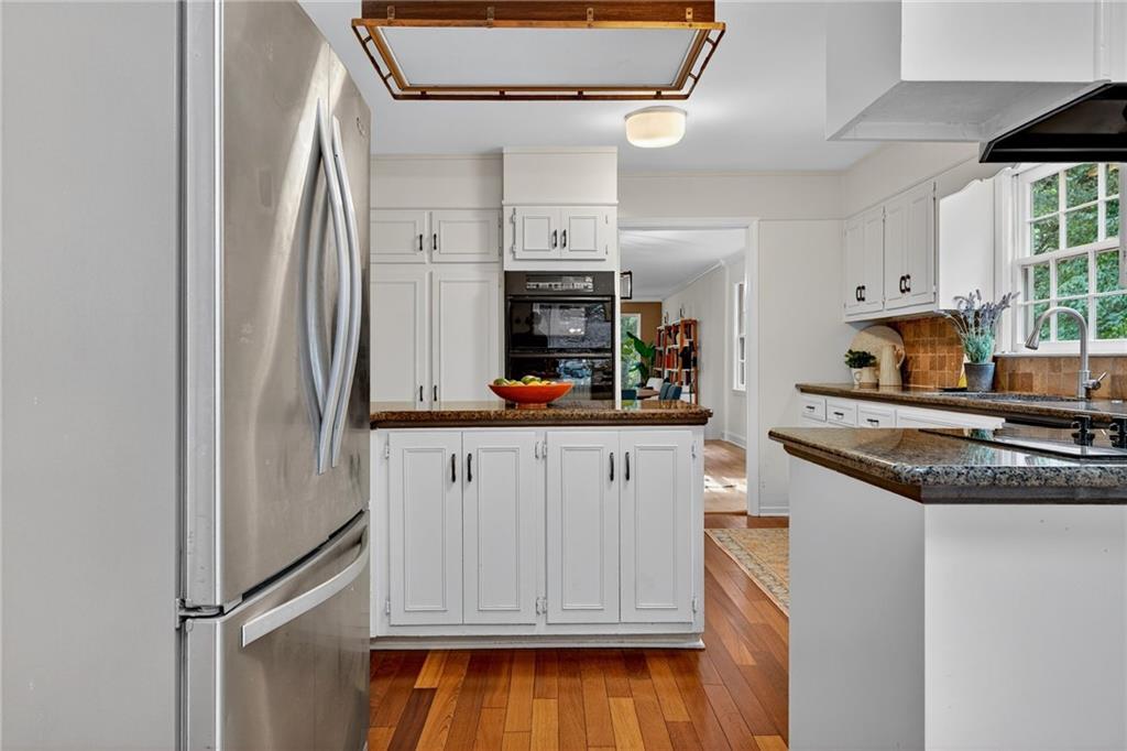 7565 Ball Mill Road Northeast Atlanta, GA 30350 - Photo 25 of 61 a kitchen with stainless steel appliances granite countertop a refrigerator and a stove