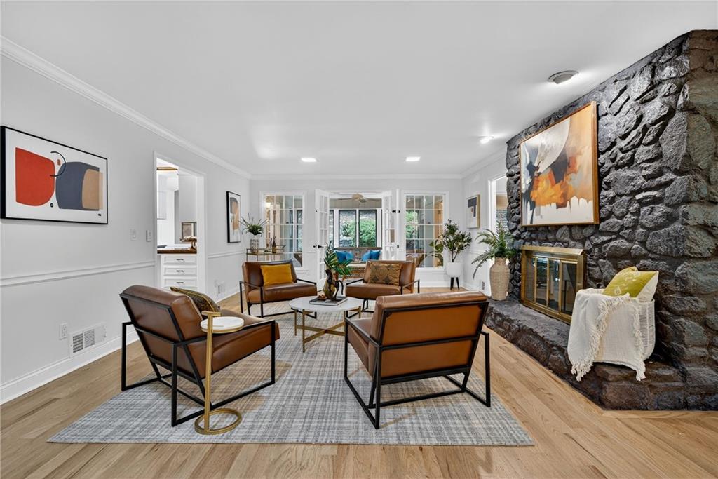 7565 Ball Mill Road Northeast Atlanta, GA 30350 - Photo 28 of 61 a living room with fireplace furniture and a rug