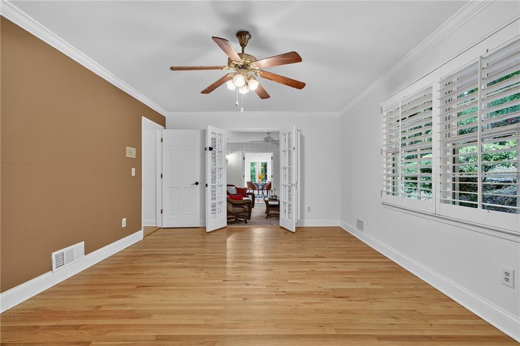 7565 Ball Mill Road Northeast Atlanta, GA 30350 - Photo 29 of 61 a view of a livingroom with a ceiling fan and window