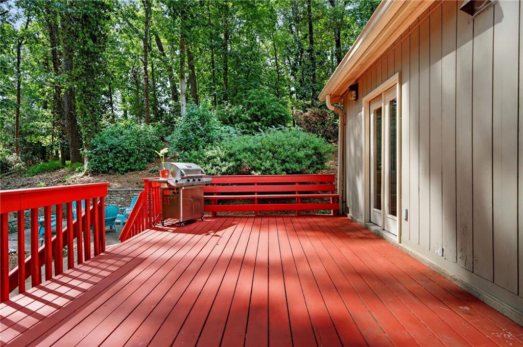 7565 Ball Mill Road Northeast Atlanta, GA 30350 - Photo 45 of 61 a backyard of a house with wooden floor and outdoor space