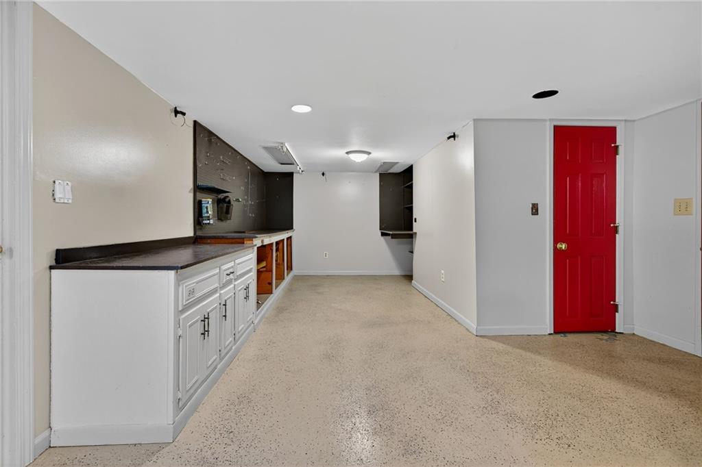 7565 Ball Mill Road Northeast Atlanta, GA 30350 - Photo 47 of 61 a kitchen with stainless steel appliances kitchen island granite countertop a refrigerator and a sink