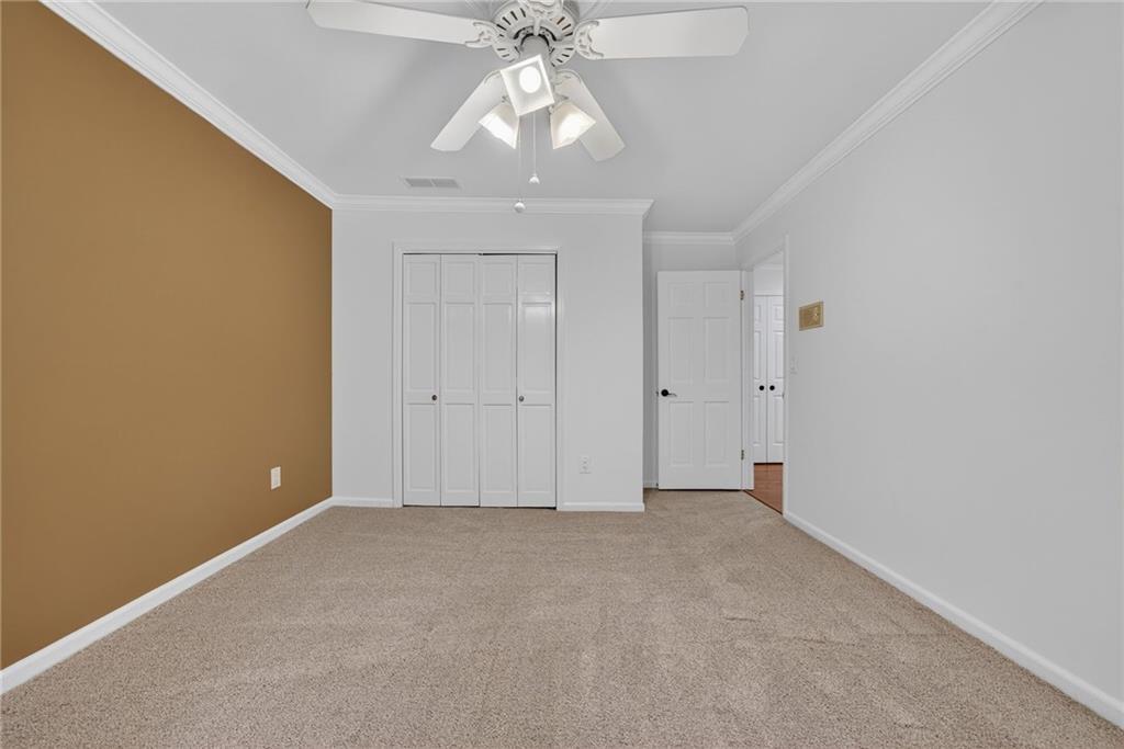 7565 Ball Mill Road Northeast Atlanta, GA 30350 - Photo 53 of 61 a view of an empty room with chandelier fan