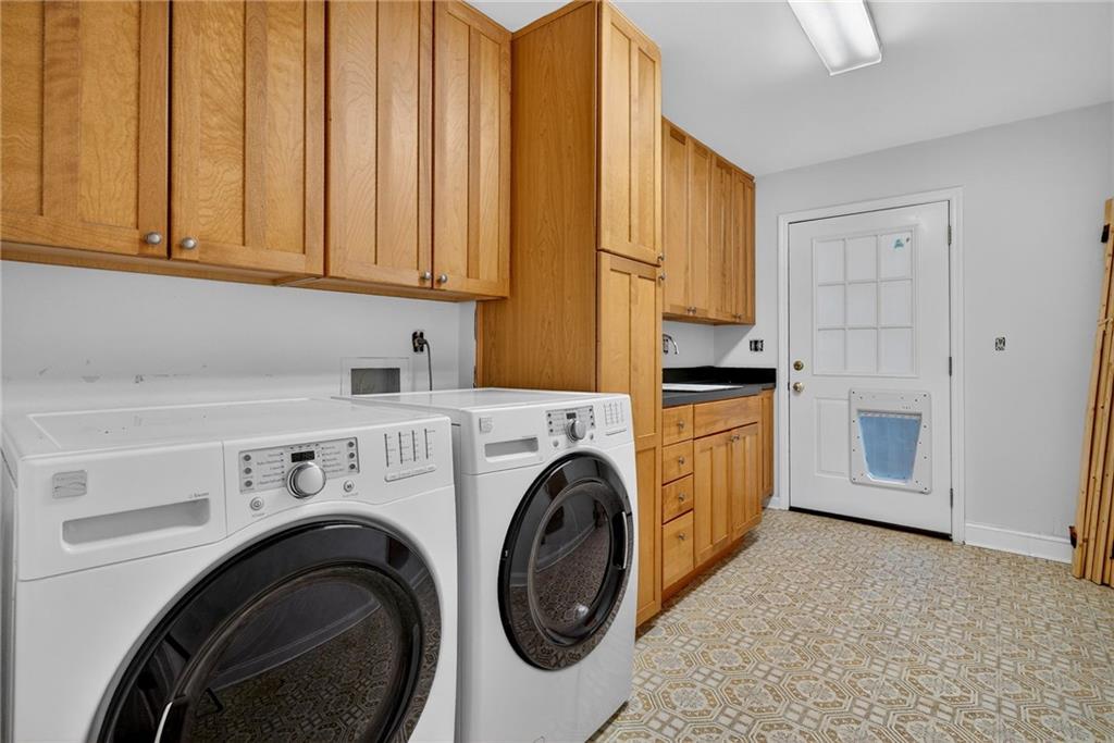 7565 Ball Mill Road Northeast Atlanta, GA 30350 - Photo 56 of 61 a utility room with dryer and washer