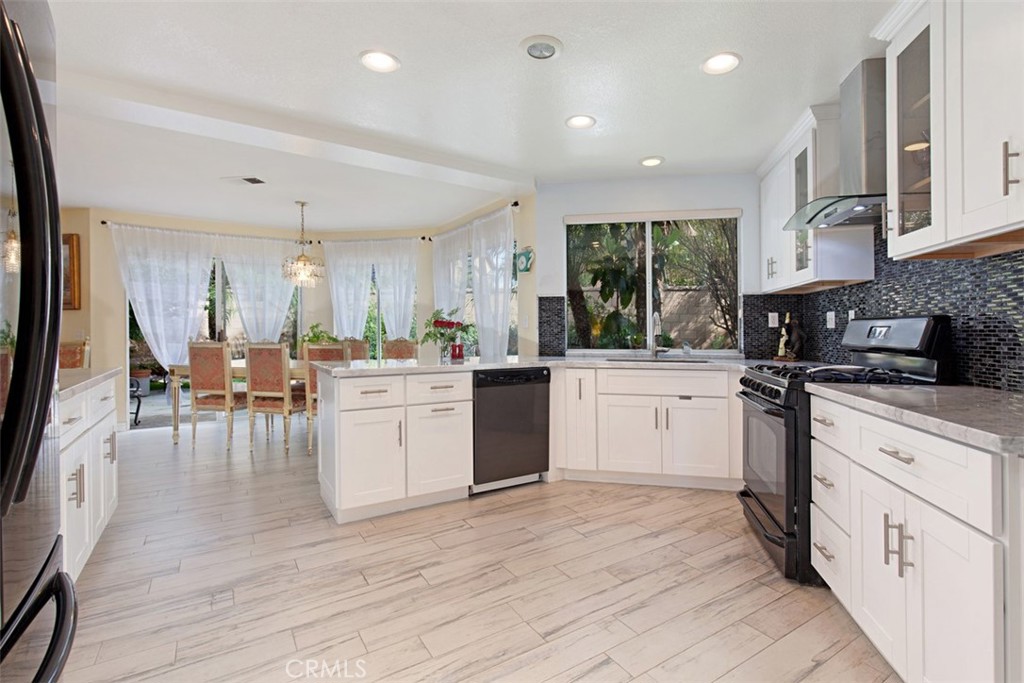 19 Tennessee Irvine, CA 92606 - Photo 15 of 40 a kitchen with a sink window and cabinets