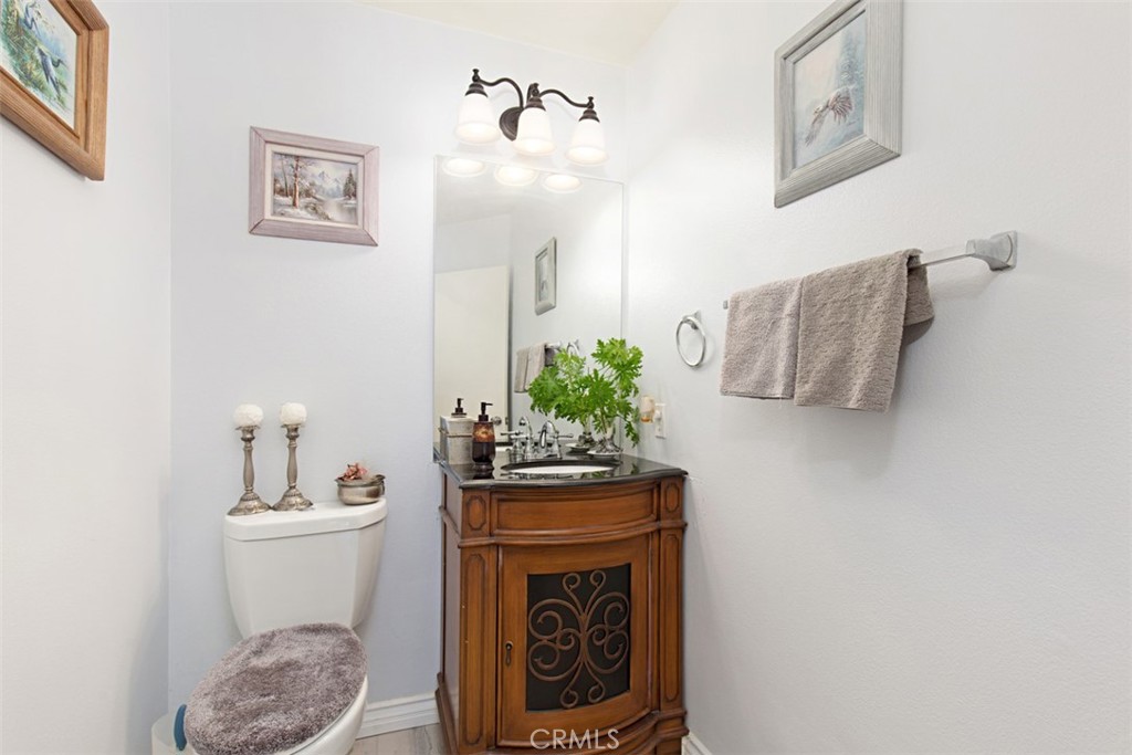 19 Tennessee Irvine, CA 92606 - Photo 18 of 40 a bathroom with a sink a toilet and mirror