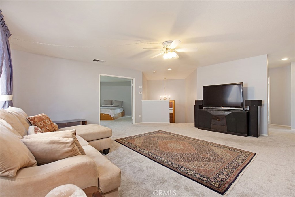 19 Tennessee Irvine, CA 92606 - Photo 21 of 40 a living room with furniture and a flat screen tv
