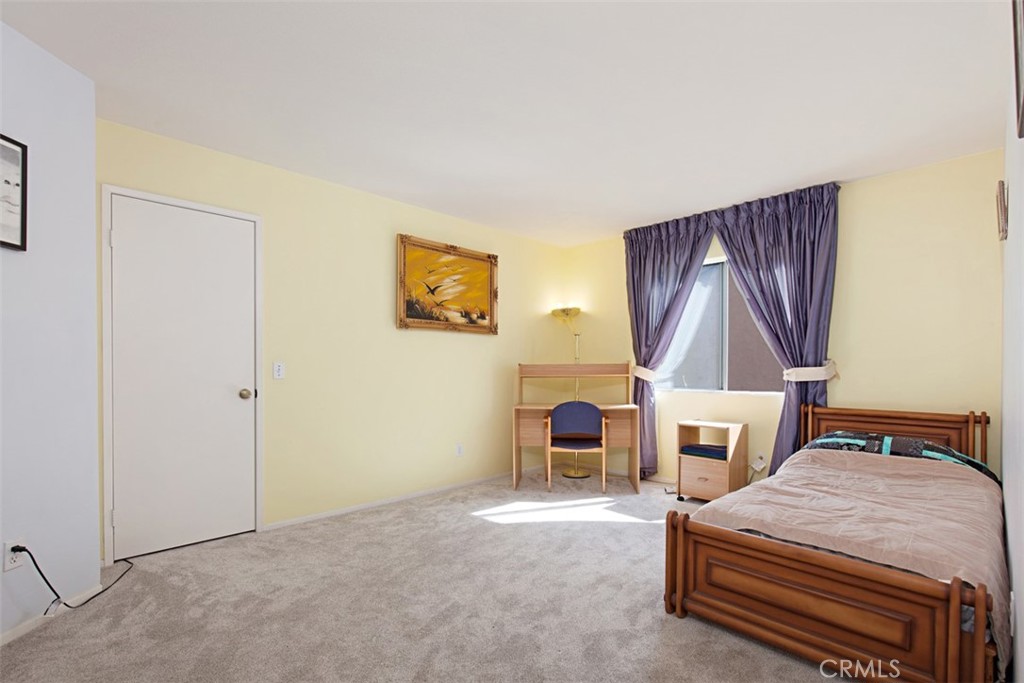 19 Tennessee Irvine, CA 92606 - Photo 22 of 40 a bedroom with a bed table chair and a stove