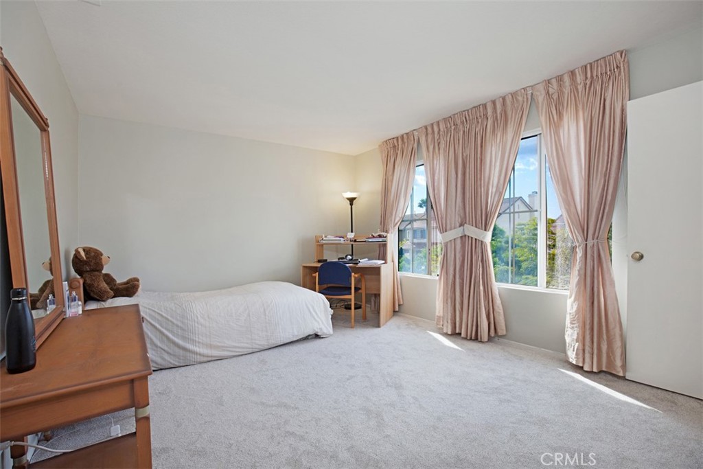 19 Tennessee Irvine, CA 92606 - Photo 24 of 40 a bedroom with a bed and a large window
