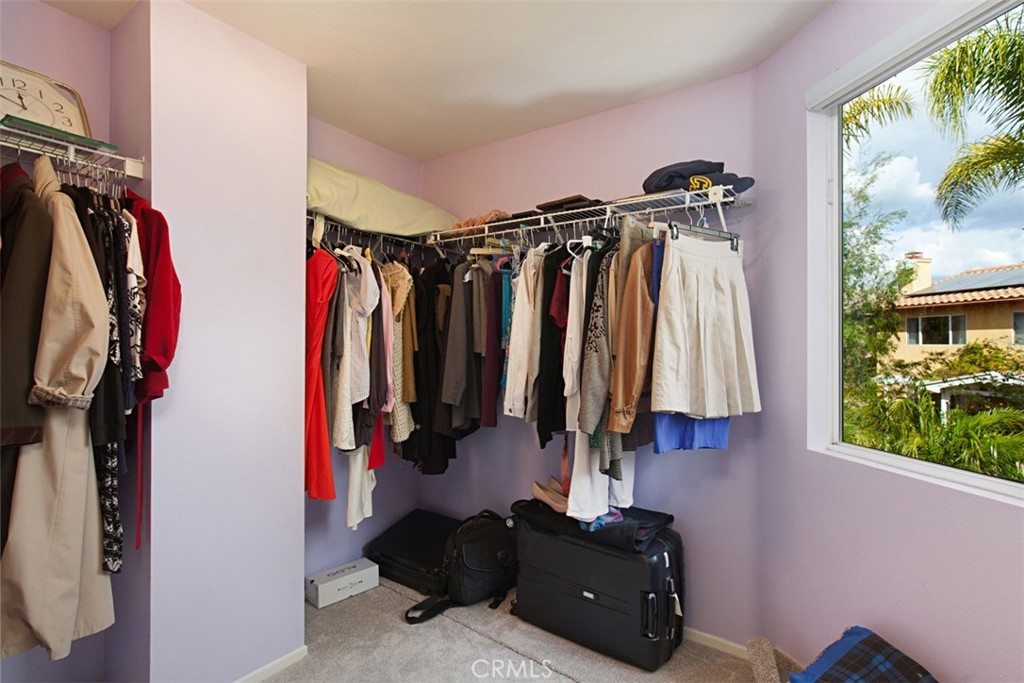 19 Tennessee Irvine, CA 92606 - Photo 29 of 40 a view of walk in closet with clothes and shoes