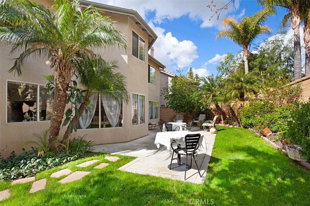 19 Tennessee Irvine, CA 92606 - Photo 34 of 40 a view of a backyard with table and chairs and potted plants