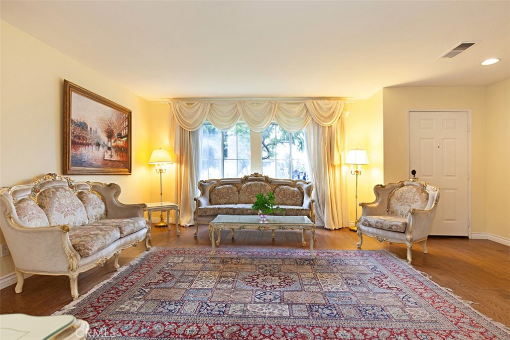 19 Tennessee Irvine, CA 92606 - Photo 4 of 40 a living room with furniture and a large window