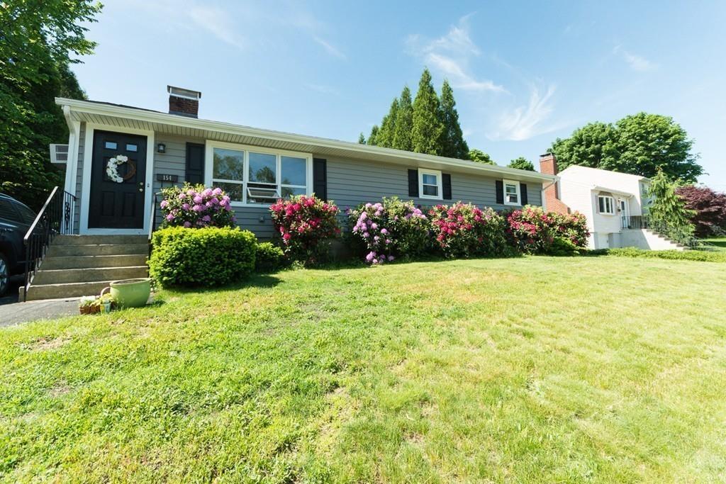 154 Ravenswood Road Waltham, MA 02453 - Photo 11 of 11 a front view of a house with garden