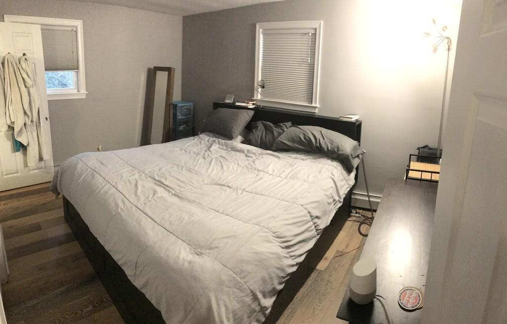 154 Ravenswood Road Waltham, MA 02453 - Photo 5 of 11 a bedroom with a bed and a window