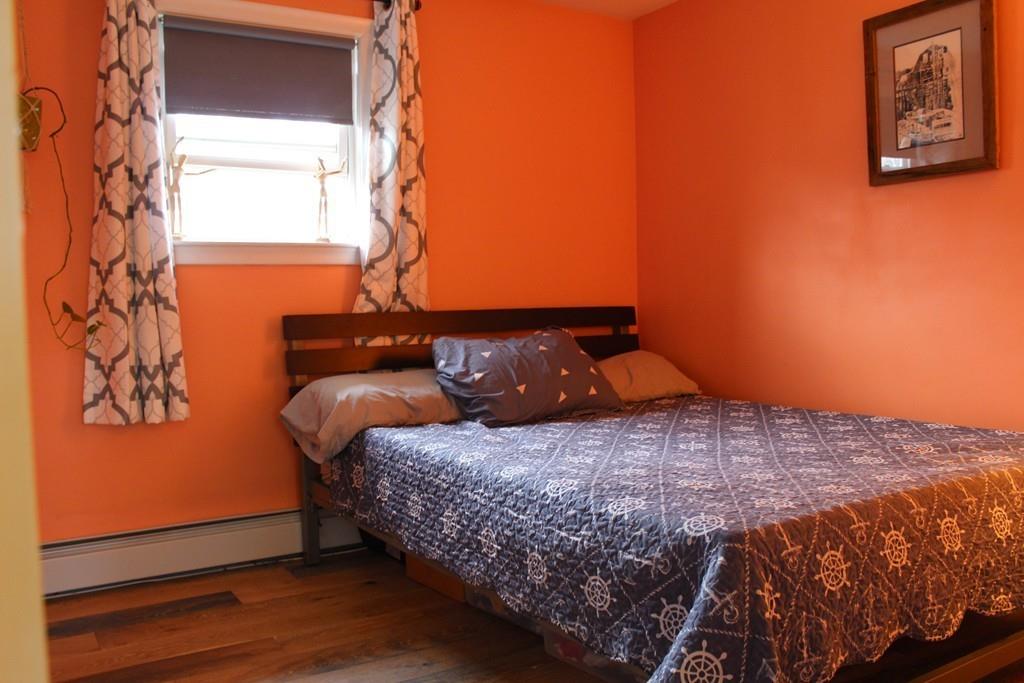 154 Ravenswood Road Waltham, MA 02453 - Photo 6 of 11 a bedroom with a bed and a window