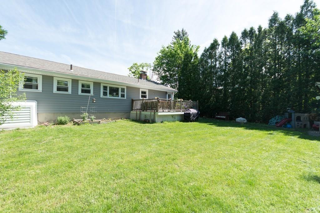 154 Ravenswood Road Waltham, MA 02453 - Photo 10 of 11 a front view of house with yard and green space