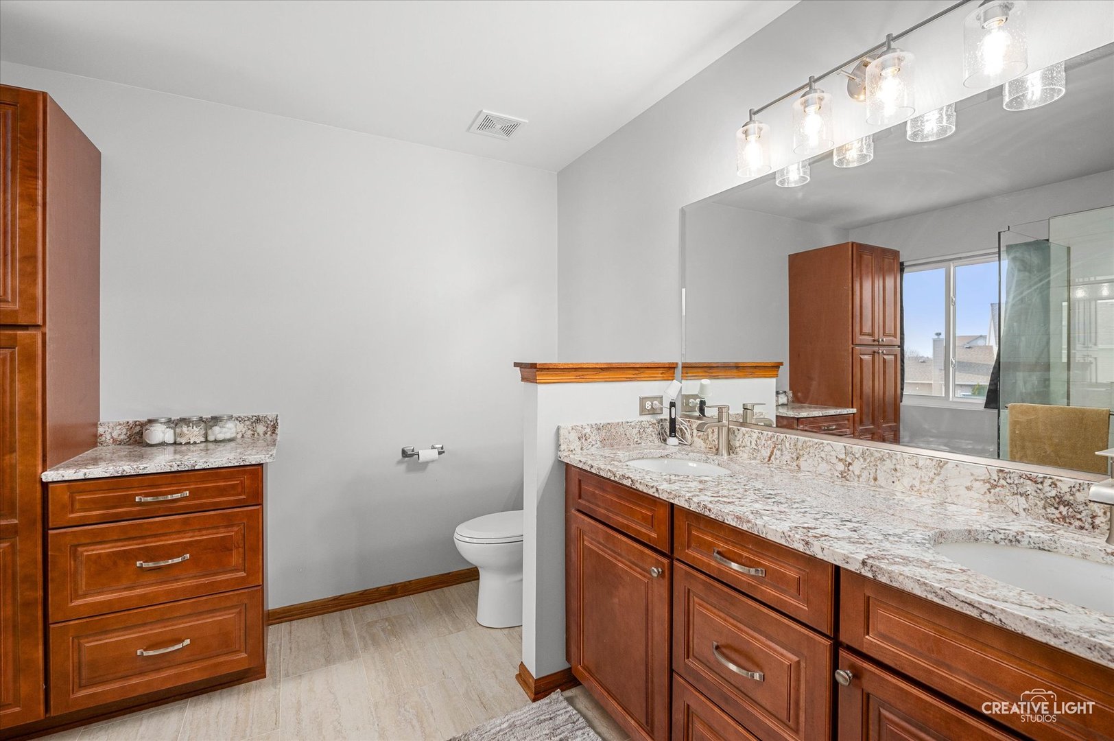 7651 Pin Oak Court Plainfield, IL 60586 - Photo 17 of 31 a bathroom with a granite countertop sink and a mirror