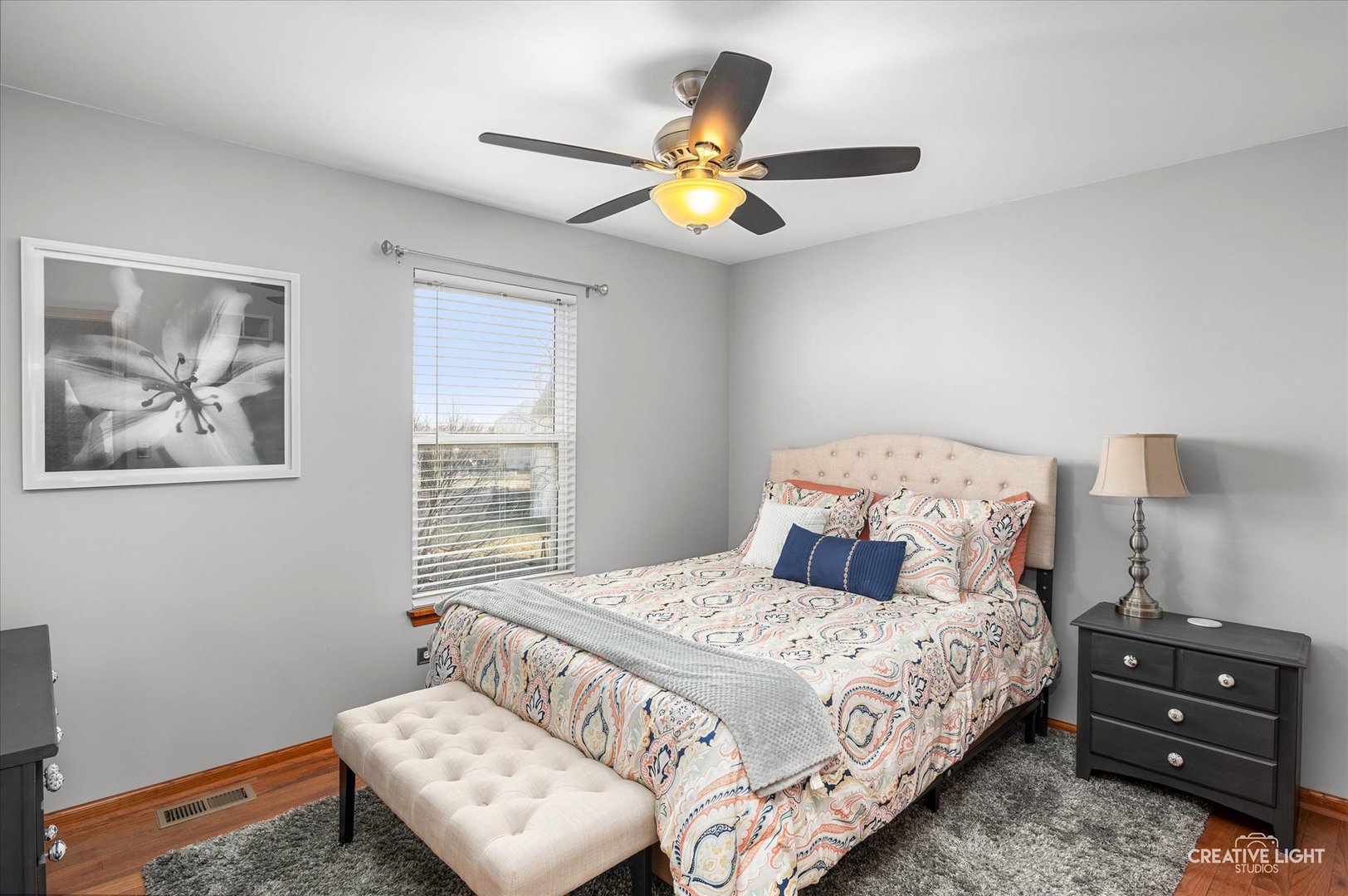 7651 Pin Oak Court Plainfield, IL 60586 - Photo 21 of 31 a bedroom with a bed and a chandelier