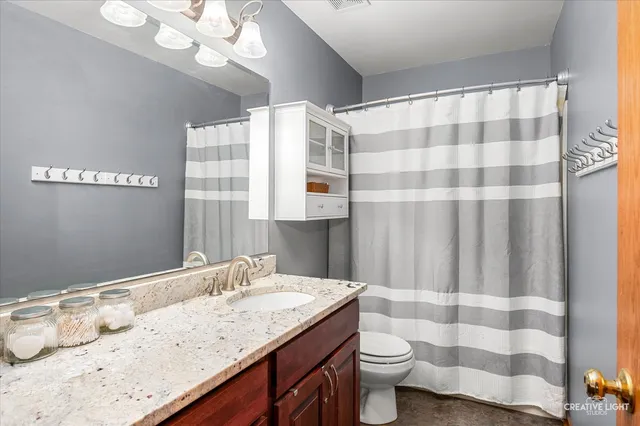 a view of a room with wooden walls