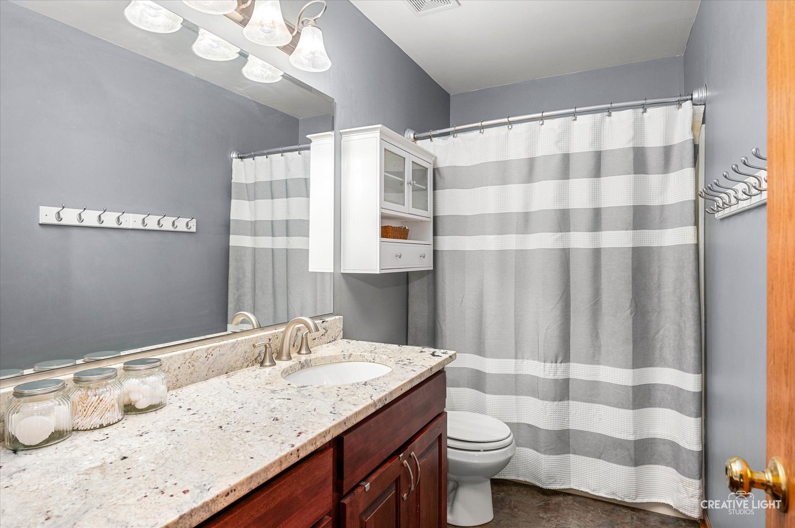 7651 Pin Oak Court Plainfield, IL 60586 - Photo 23 of 31 a bathroom with a granite countertop sink and a mirror