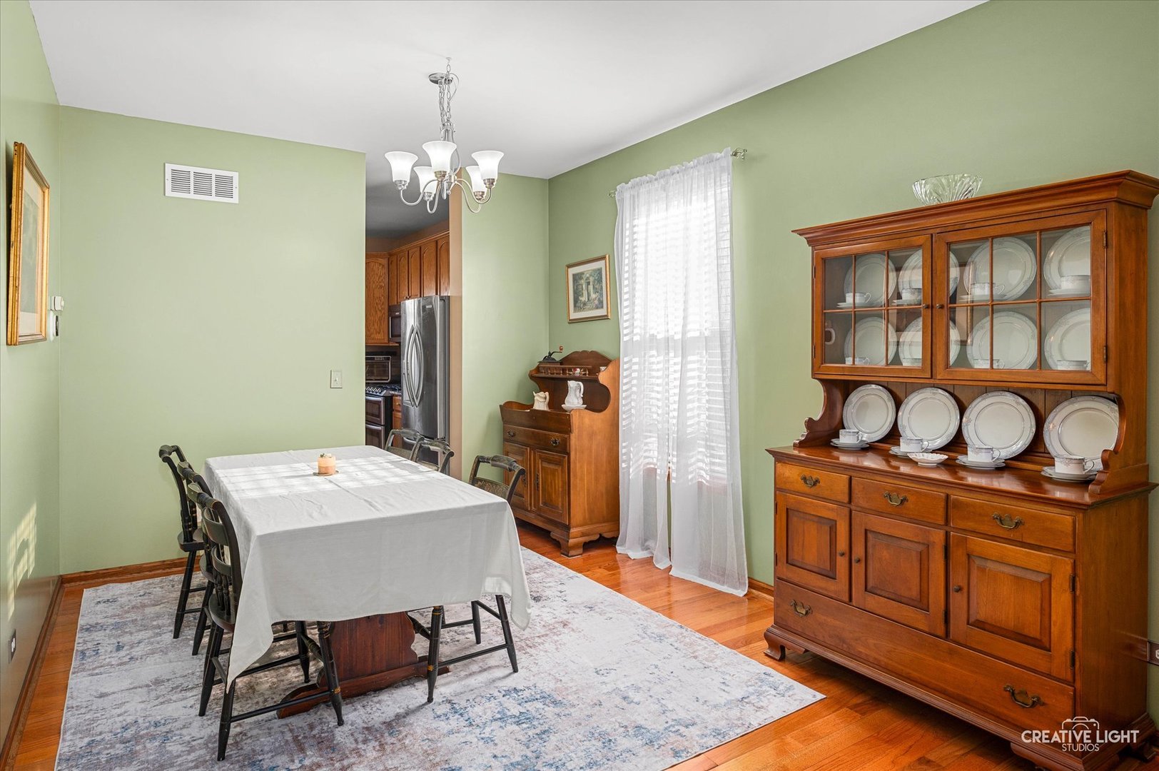 7651 Pin Oak Court Plainfield, IL 60586 - Photo 6 of 31 a view of a dining room with furniture and chandelier