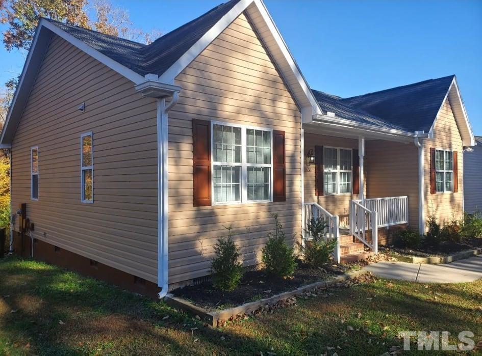 2533 Friendly Trail Raleigh, NC 27610 - Photo 2 of 20 a front view of a house with garden