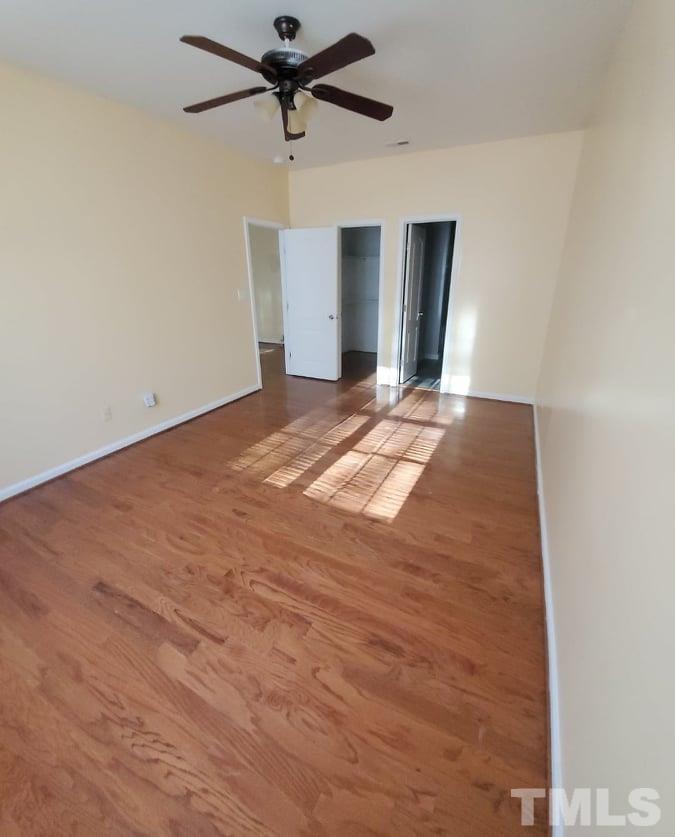 2533 Friendly Trail Raleigh, NC 27610 - Photo 11 of 20 a view of a big room with closet and ceiling fan