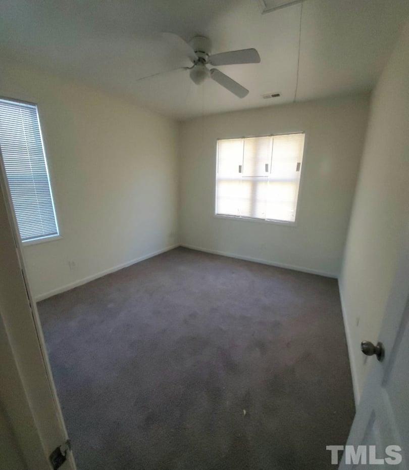 2533 Friendly Trail Raleigh, NC 27610 - Photo 14 of 20 an empty room with a window