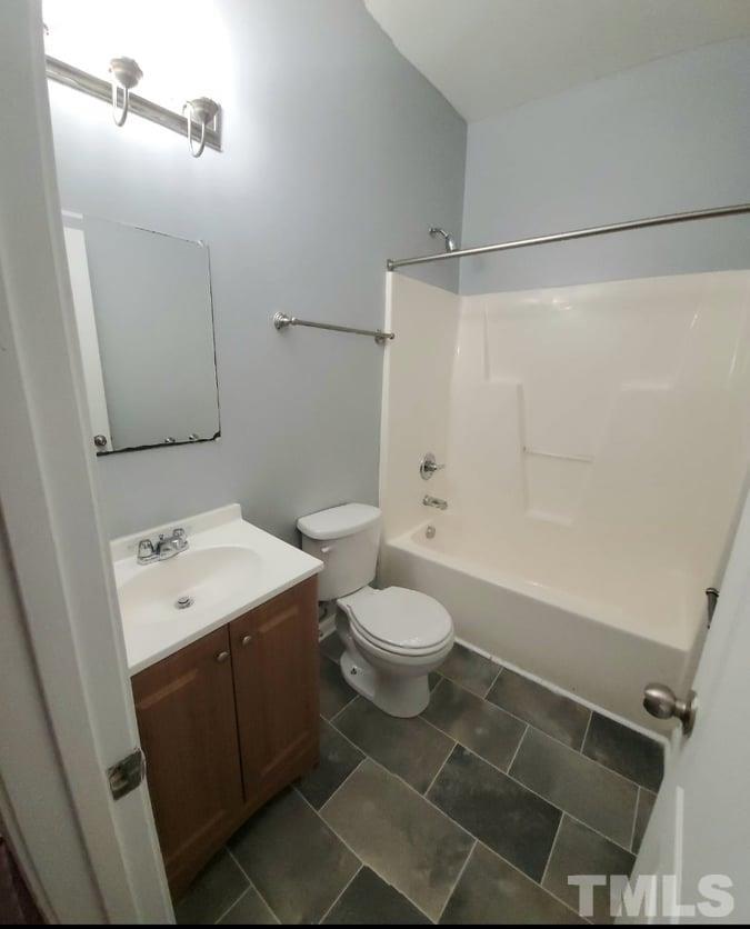 2533 Friendly Trail Raleigh, NC 27610 - Photo 16 of 20 a bathroom with a sink a toilet and shower