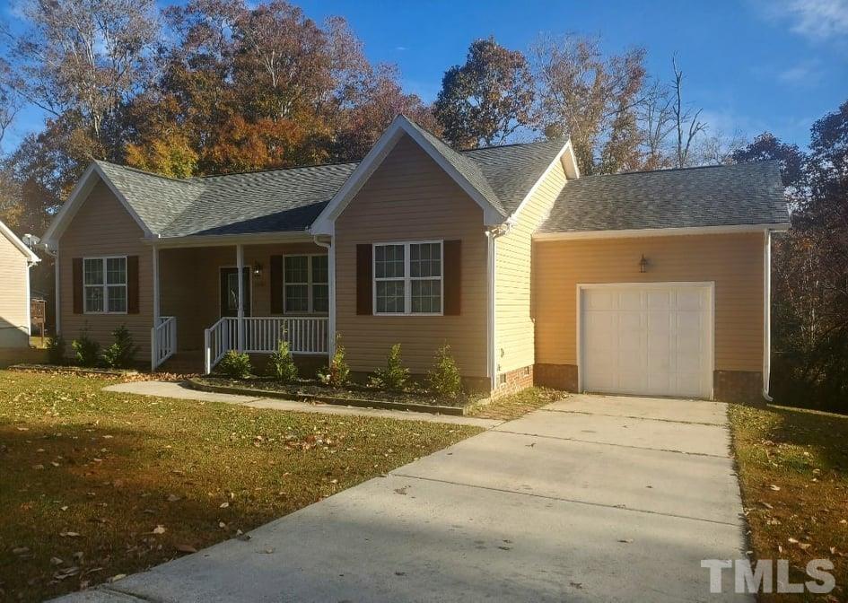 2533 Friendly Trail Raleigh, NC 27610 - Photo 20 of 20 a front view of a house with a yard
