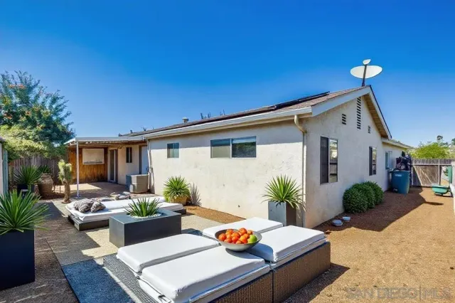 a outdoor space with patio furniture and potted plants