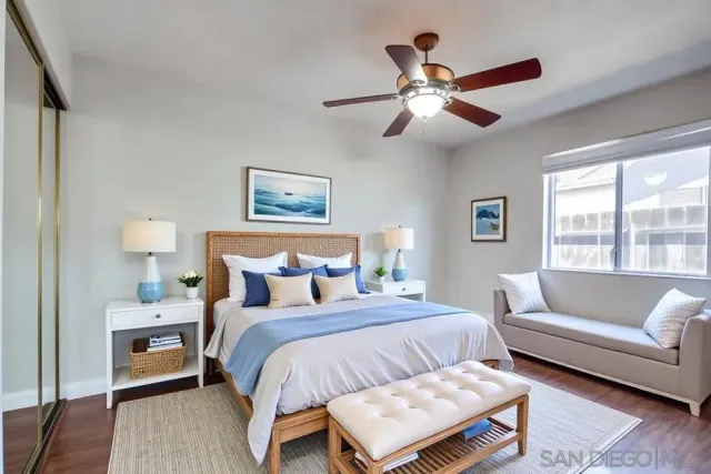 a bedroom with a large bed and a couch