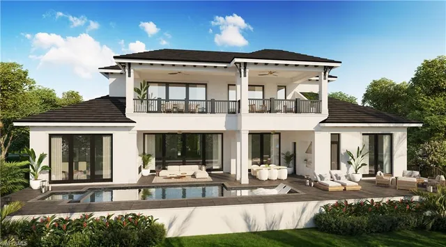 a front view of a house with a yard outdoor seating and patio